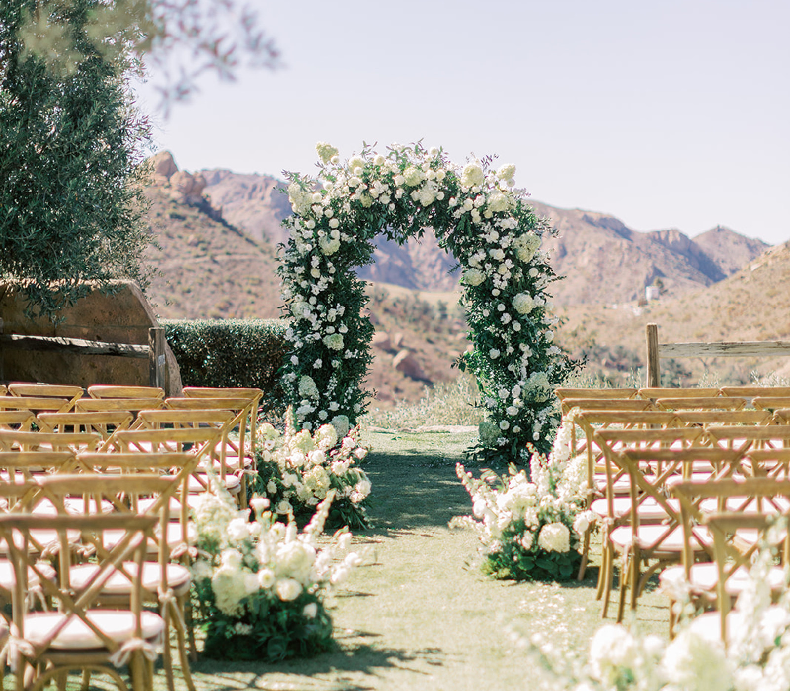 Classic white wedding ceremony florals at Cielo Farms by Velvet Blooms